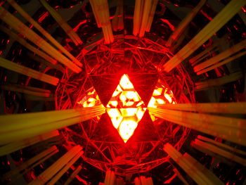 Low angle view of illuminated lights at night