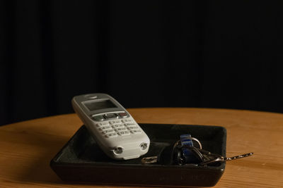 Close-up of smart phone on table