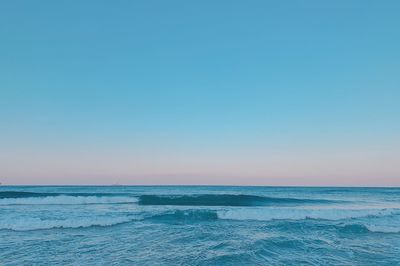 Scenic view of sea against clear blue sky