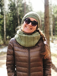 Portrait of smiling woman in warm clothing