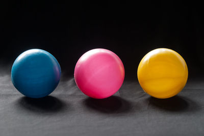 Close-up of multi colored balls on table