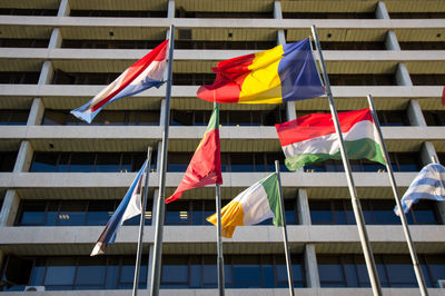 Low angle view of flags against building