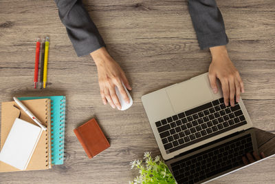 High angle view of man using laptop on table