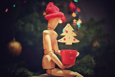Close-up of figurine with christmas tree