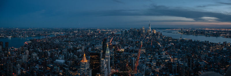 High angle view of city lit up at dusk