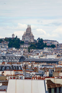 Paris cityscape from above. montmartre hill and sacre coer church stand out in the view