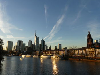 Panoramic view of river and buildings against sky