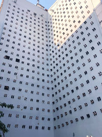 Low angle view of text on building against sky