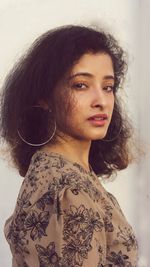 Portrait of a beautiful young woman looking away