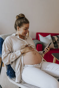 Pregnant woman using cell phone