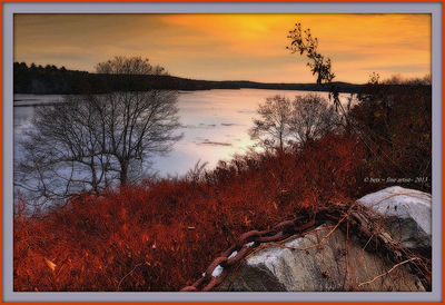 Scenic view of lake at sunset