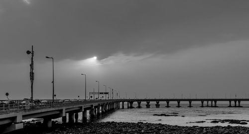 Bridge over sea against sky