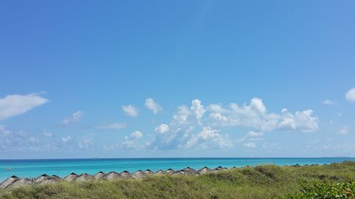 Scenic view of sea against blue sky