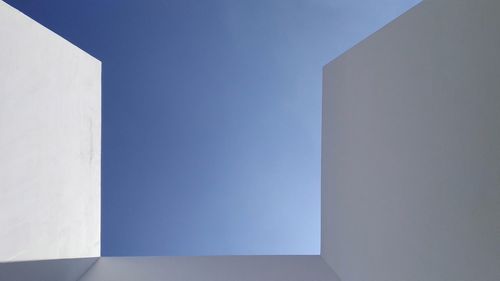 Low angle view of building against blue sky