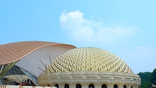 Low angle view of building against blue sky