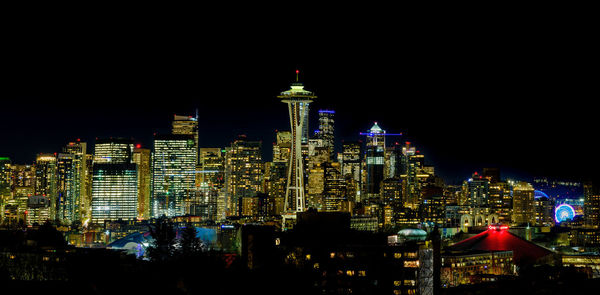 Illuminated buildings in city at night