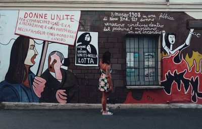 People on graffiti wall
