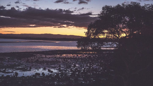 Scenic view of sea against sky at sunset