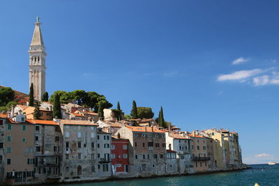 Buildings in city against sky