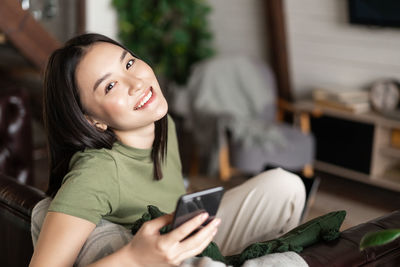 Young woman using mobile phone