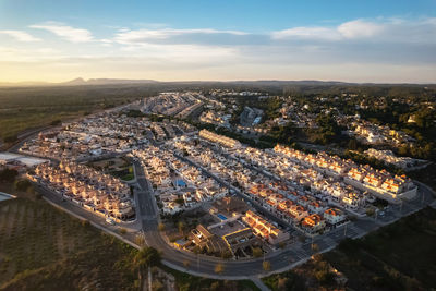 Aerial view of townscape during sunset