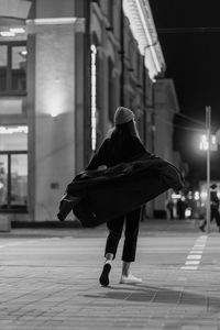 The girl walks around the city.