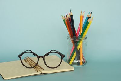 Close-up of multi colored pencils on table