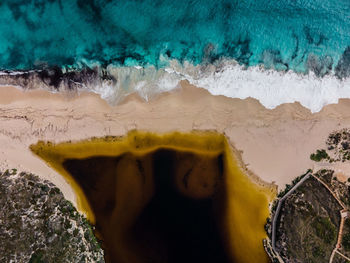 High angle view of coffee beans on beach