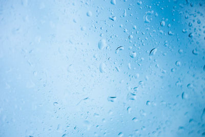 Full frame shot of wet glass window