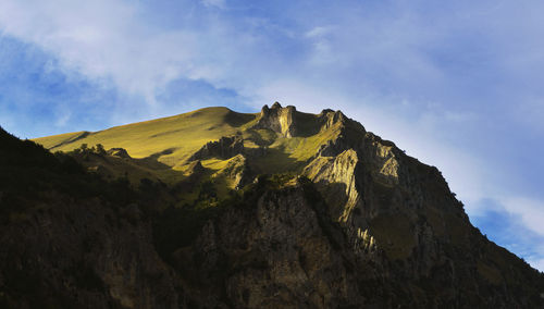 Low angle view of rock formations against sky