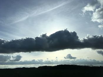 Low angle view of silhouette landscape against sky