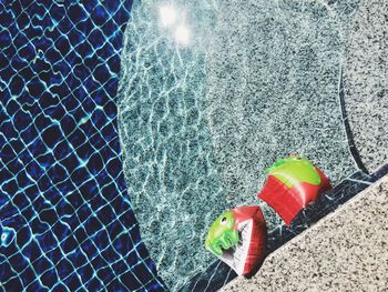 High angle view of water wings in swimming pool