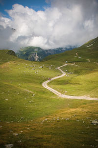 Scenic view of landscape in alps against sky