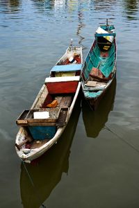 Boats moored in lake