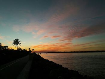 Scenic view of beach against sky during sunset