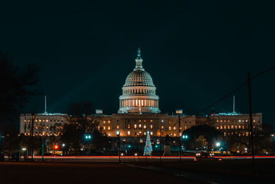 Illuminated buildings in city at night