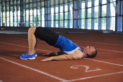 Man exercising on running track, algarve, portugal