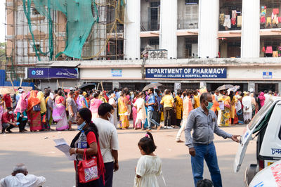 People standing on street in city