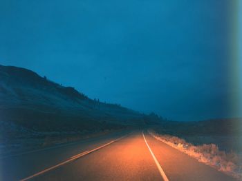 Road amidst landscape against clear sky