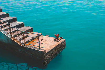 High angle view of steps over sea