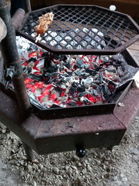 High angle view of fish on barbecue grill