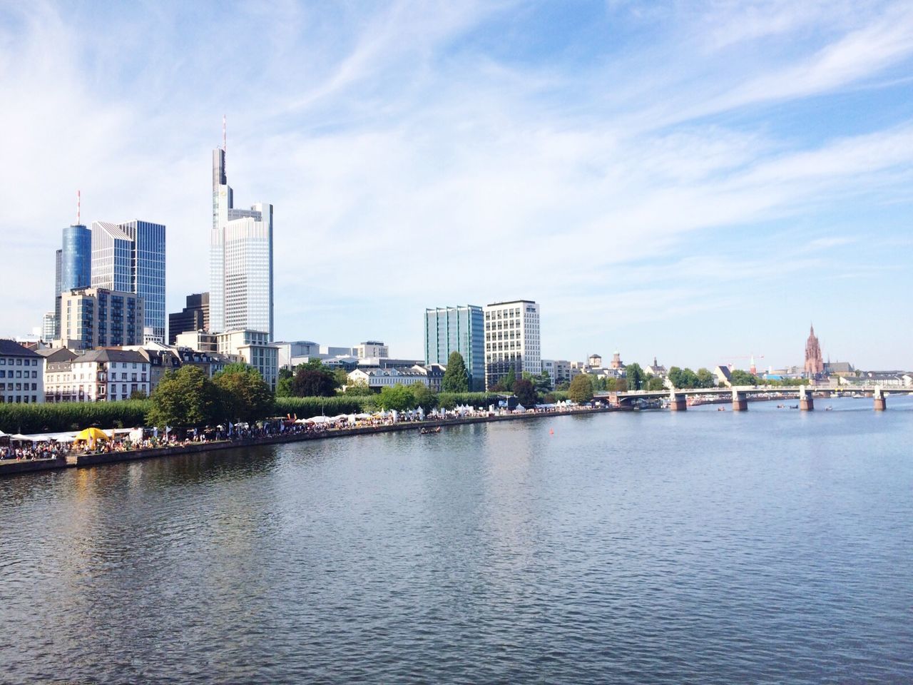 architecture, building exterior, built structure, water, city, sky, waterfront, river, cloud - sky, cloud, cityscape, sea, transportation, blue, nautical vessel, skyscraper, rippled, day, urban skyline, outdoors