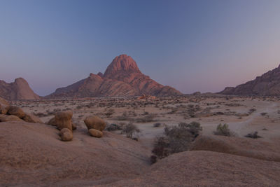 Scenic view of rocky mountains against clear sky