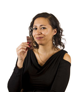 Portrait of young woman against white background