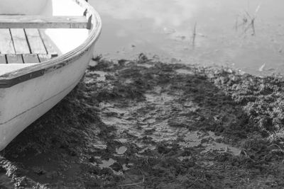 Close-up of boat moored in water
