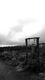 Lifeguard hut on field against sky