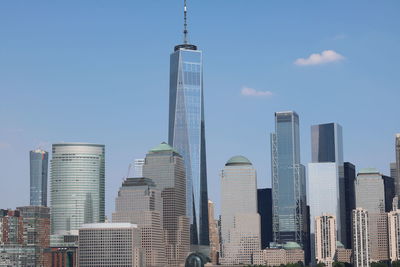 Modern buildings in city against sky