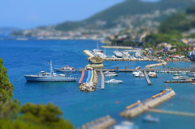 Boats in sea against sky