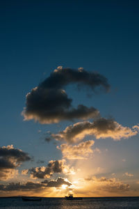 Low angle view of sea against sky during sunset