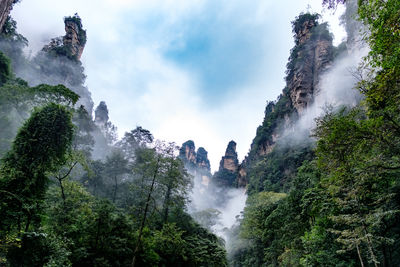 Panoramic view of waterfall against sky